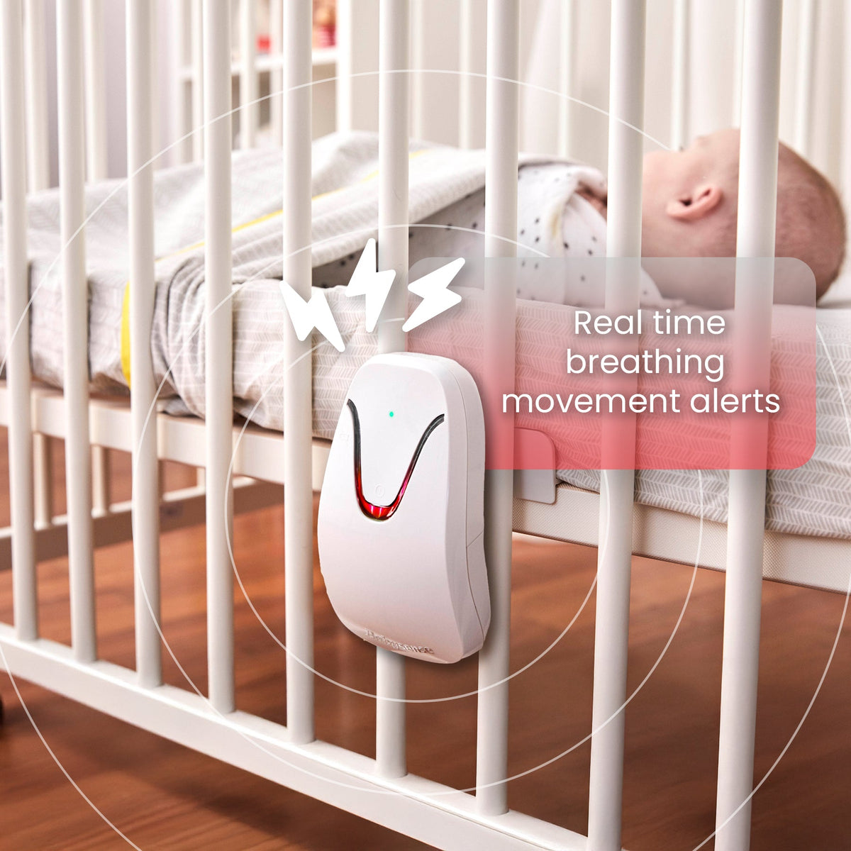 A white Babysense HOME 2-in-1 Monitoring Set device with a red light, attached to a baby's crib, offers real time breathing movement alerts, making it perfect for baby safety products for home