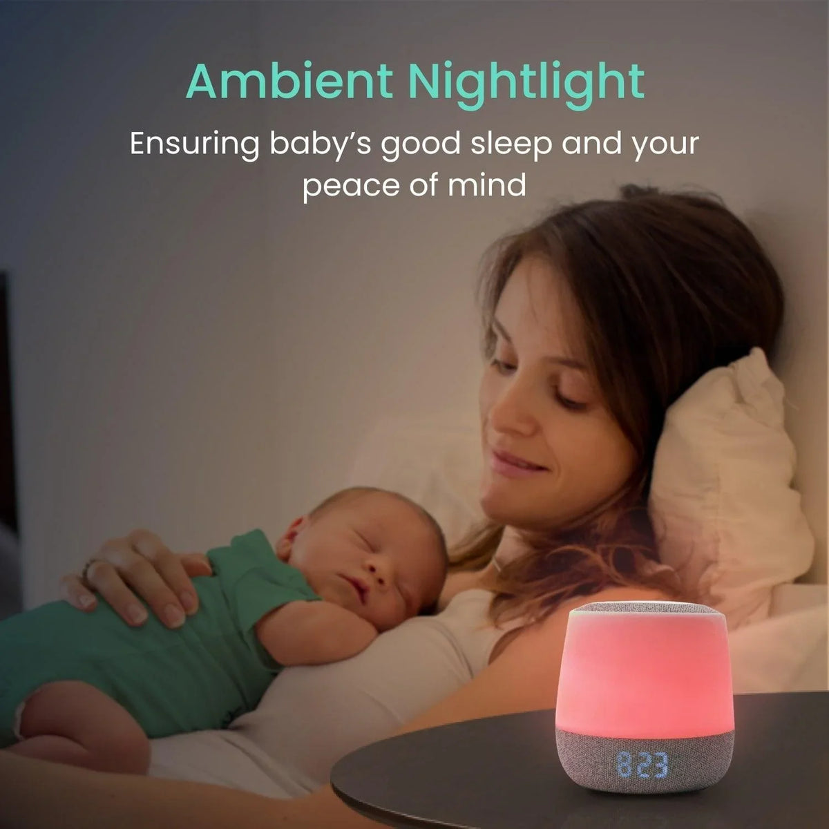 A mother and baby sleep peacefully in bed while a Babysense Dreamer 2.0 & Pro, acting as a baby sleep monitor, emits a soft red ambient light from a nearby nightstand