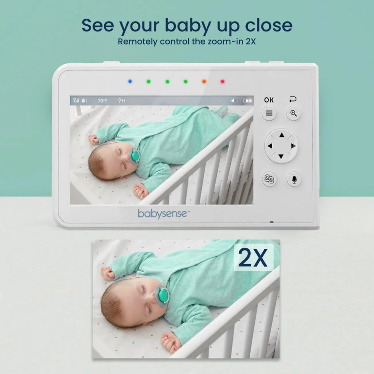 A white Babysense V43 video baby monitor displays a tranquil image of a sleeping baby in a crib, with the ability to remotely control the zoom-in 2X, making it an excellent baby monitor with 2 cameras