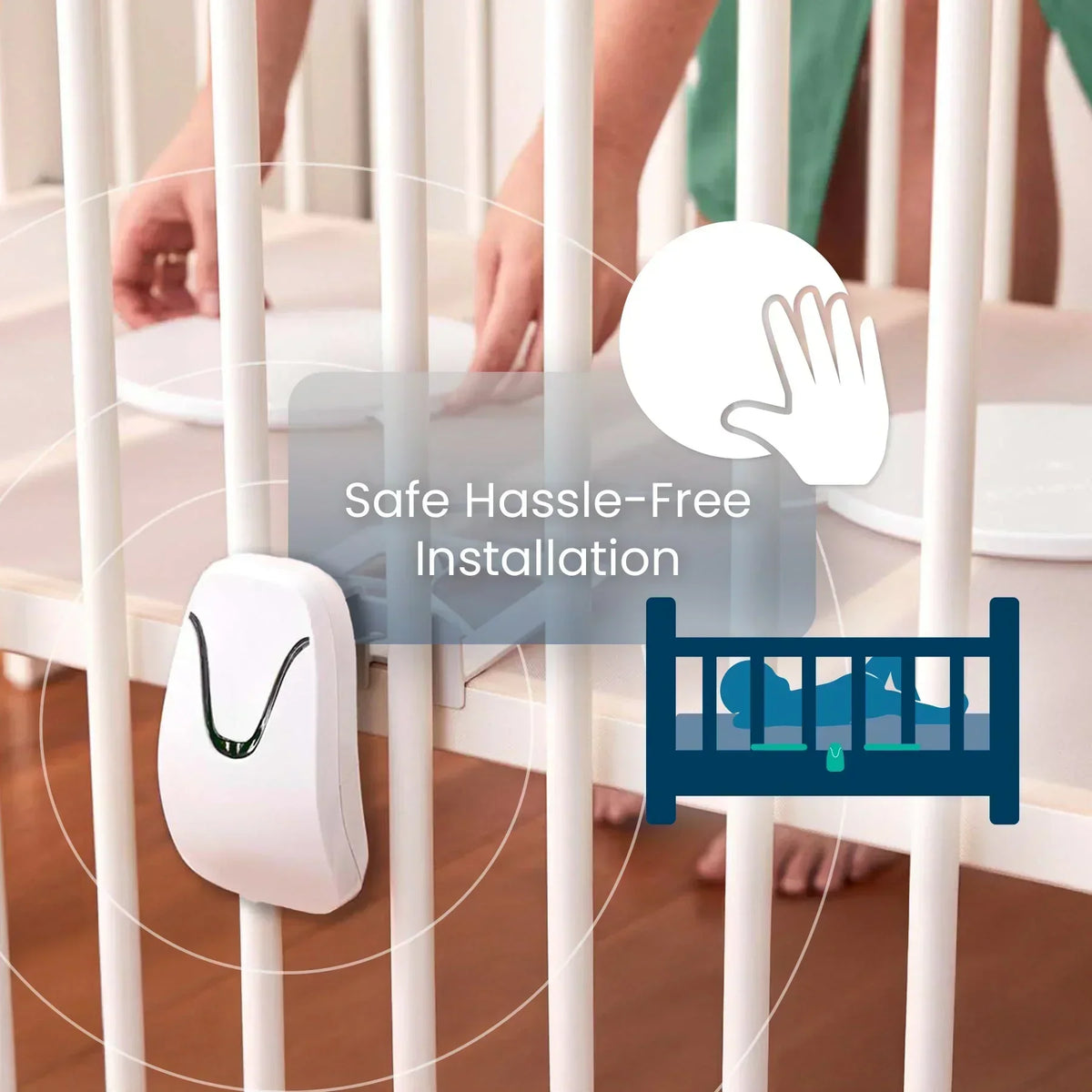 A person places a white circular mat inside a crib, illustrating the safe and hassle-free installation of the Babysense 7 & V24 video baby monitor system, with a white sensor attached to the crib slats