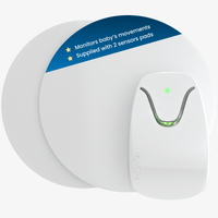 The Babysense 7 baby monitor with motion detection features a white main unit with green lights and two white sensor pads, designed to discreetly monitor a baby's movements