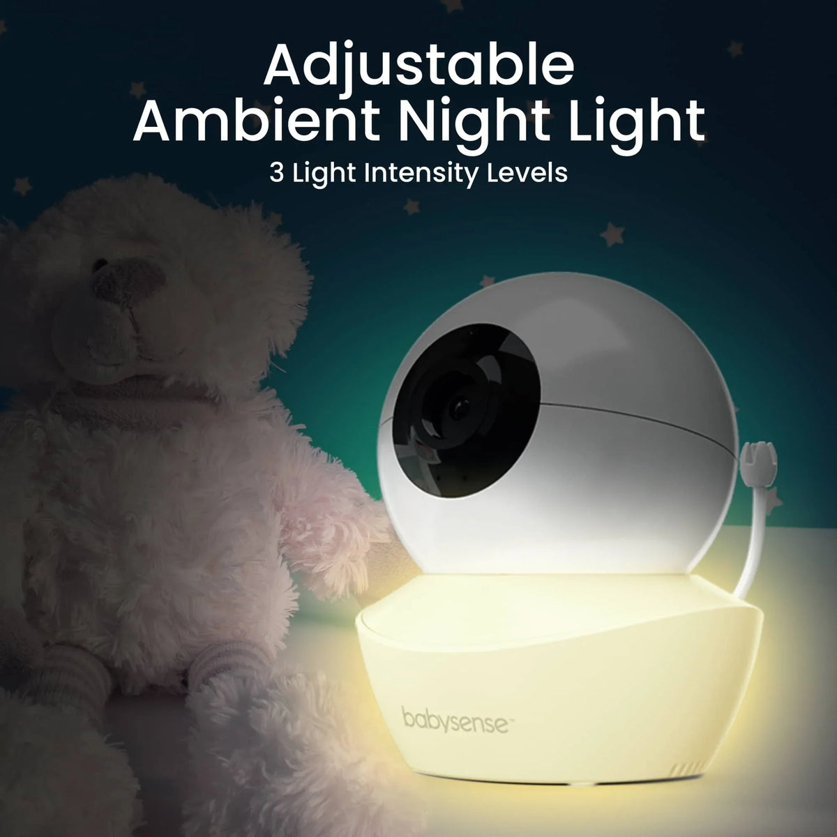 The Babysense Sleep & Monitor Pack includes a white baby wireless hd camera with an adjustable ambient night light, shown next to a plush teddy bear in a dim room with subtle star patterns on the wall