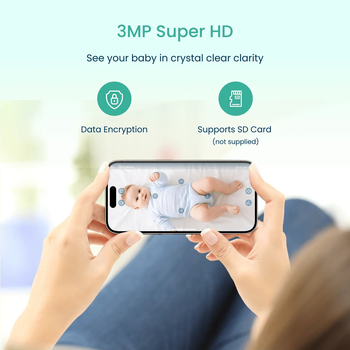 A person holds a black smartphone, displaying a live feed of a baby on a white sheet, demonstrating the 3MP Super HD video baby monitor with data encryption and SD card support by Babysense