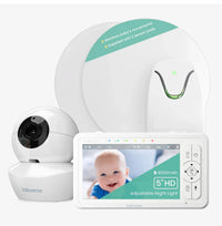 A white Babysense True Sleep video baby monitor and camera are displayed with two sensor pads and a screen showing a smiling baby, featuring movement detection