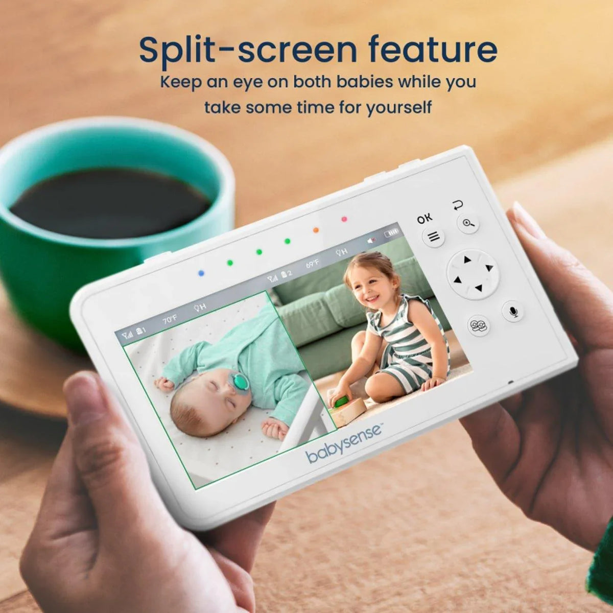 A person holds the white Babysense V43 video baby monitor, displaying a split screen with a sleeping baby and a toddler, perfect for a baby monitor with 2 cameras